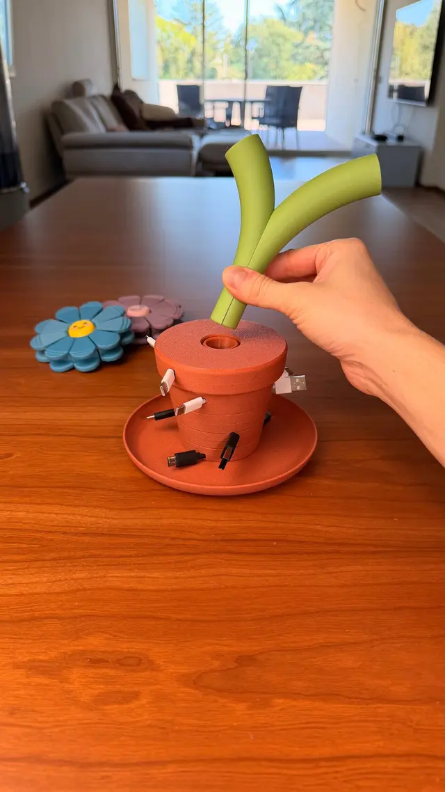 The long stem of a flower placed in the Bloom Stack vase