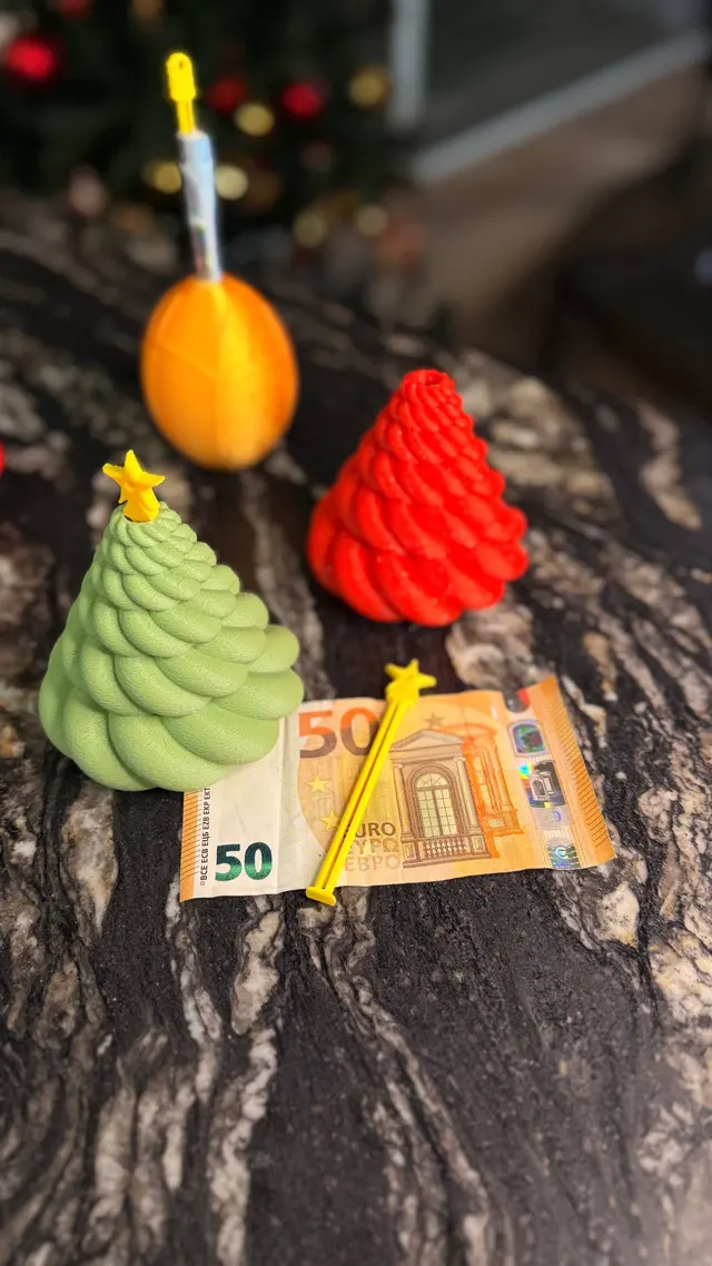 A rolled banknote next to the open ornaments