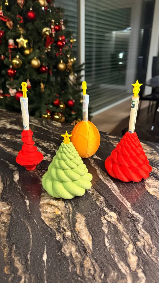 The ornaments with the pin pulled out and the rolled banknote