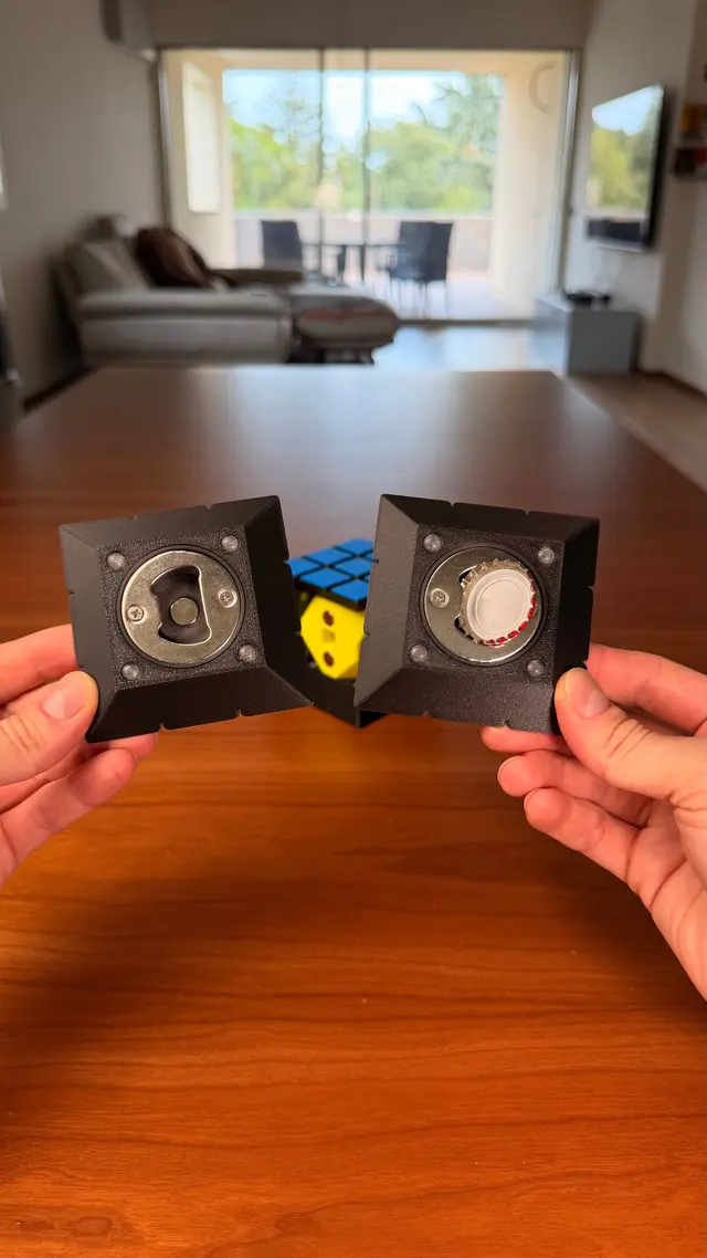 Two faces of the cube removed, with the bottle opener on the back