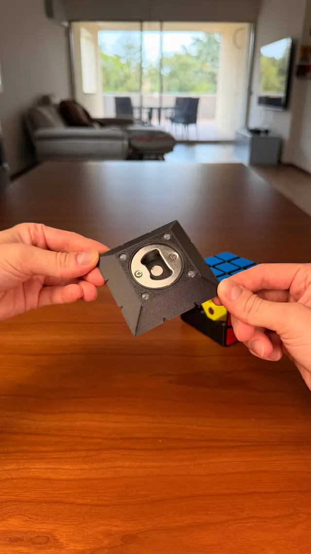 One face of the cube with the metal bottle opener