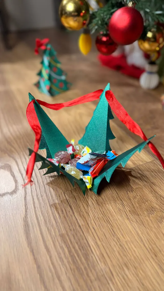 The little tree open with a small gift in the middle