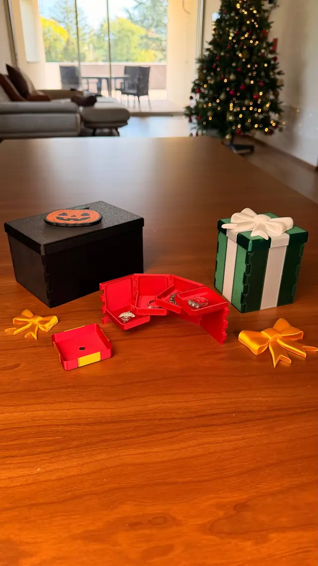 The four walls of the red Gift Reveal opened in a row, with the shelves, and the lid beside them