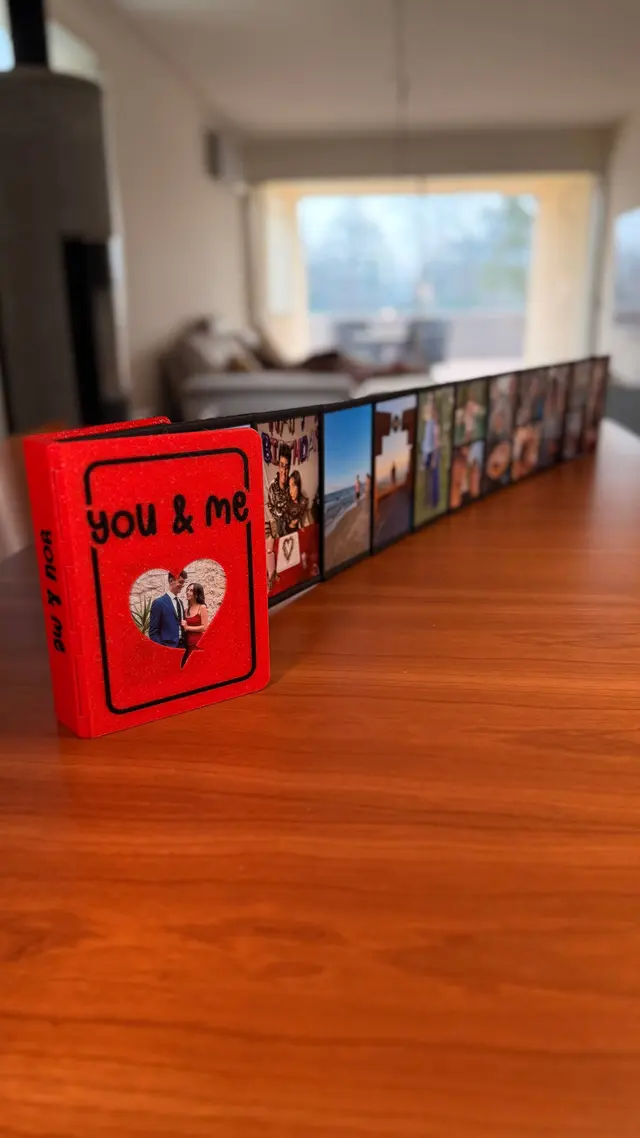 Red Love Book standing up with its pages open behind it