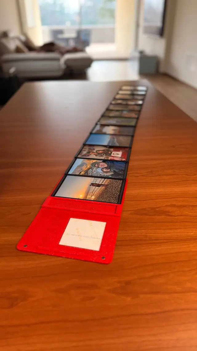 The Love Book's pages opened like an accordion on the table, full of photos
