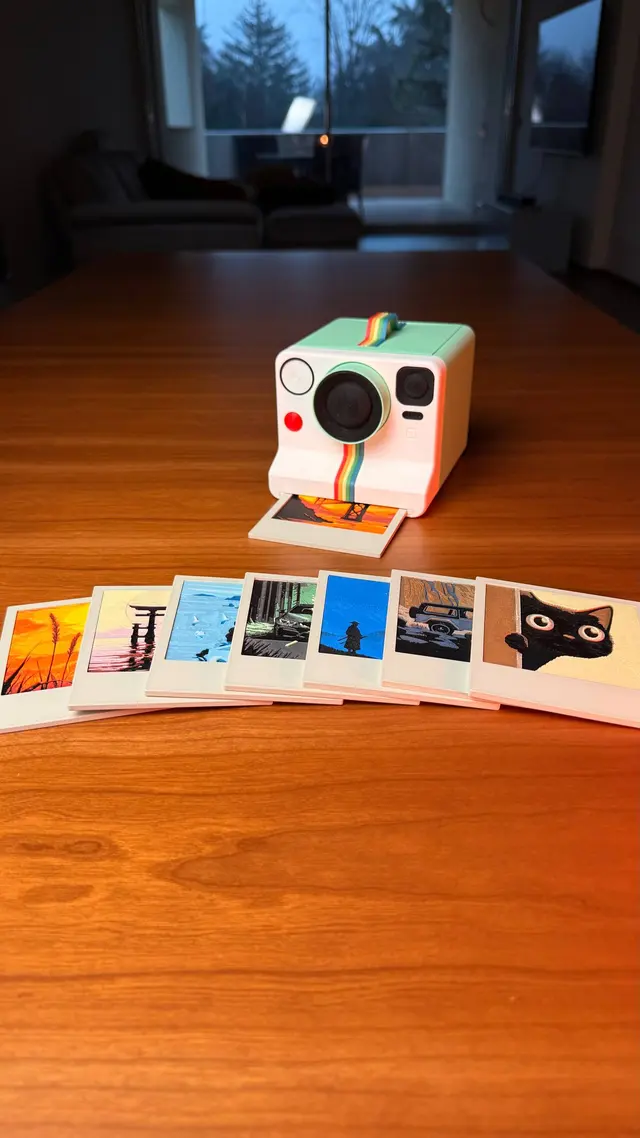 The 8 instant photo coasters in a row in front of the camera