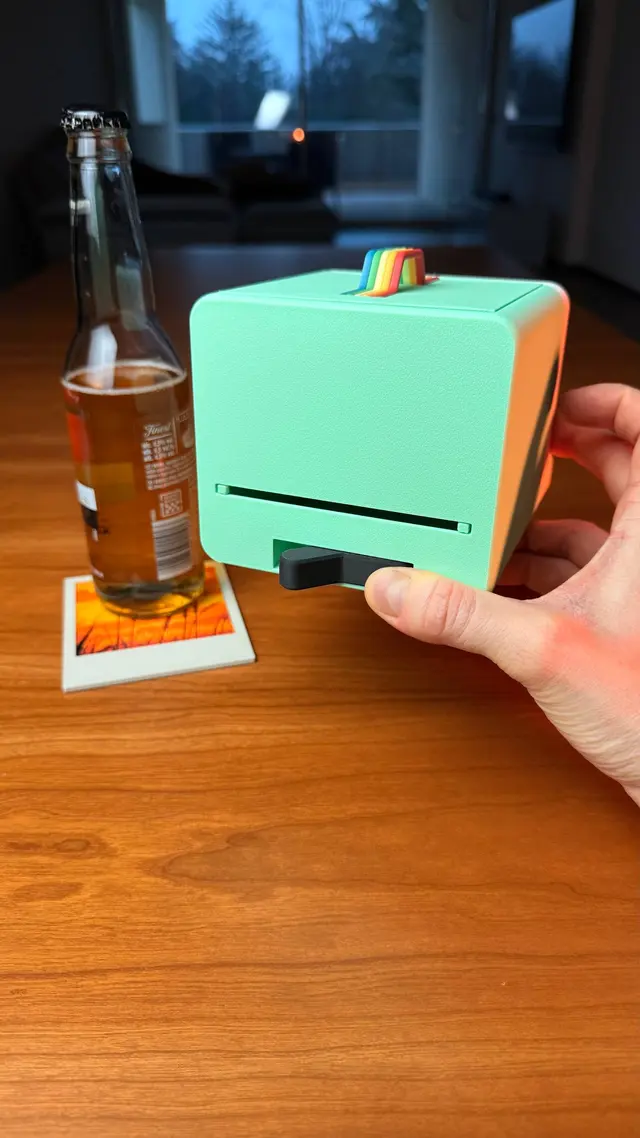Two hands holding the camera seen from behind