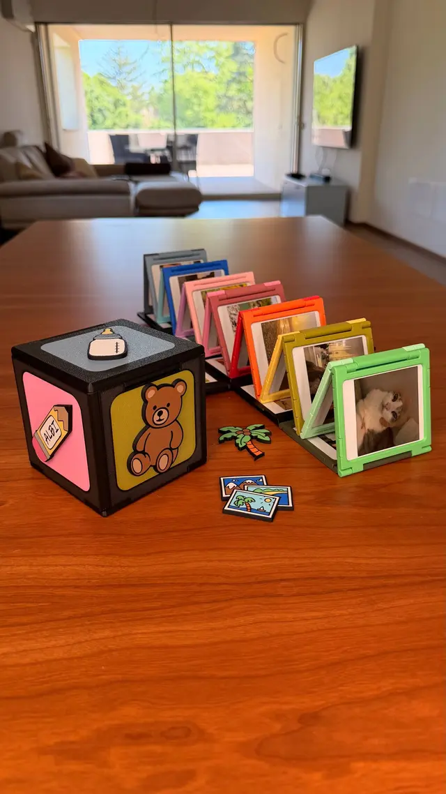 The Memory Cube open with its accordion of coloured photos