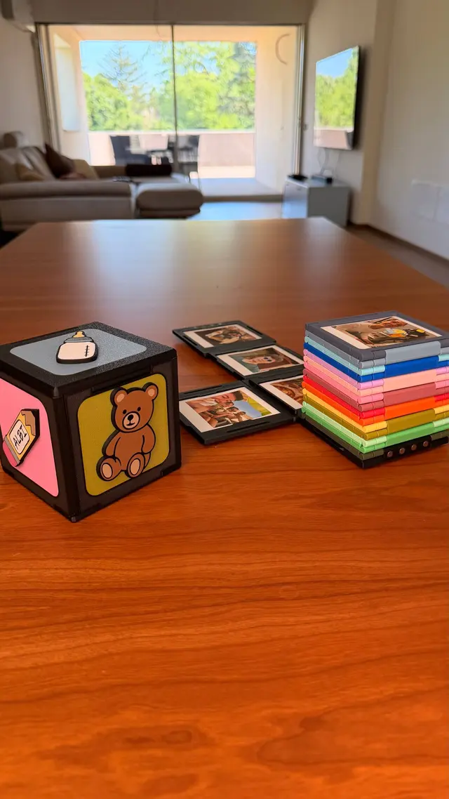 The closed cube with photos on its faces