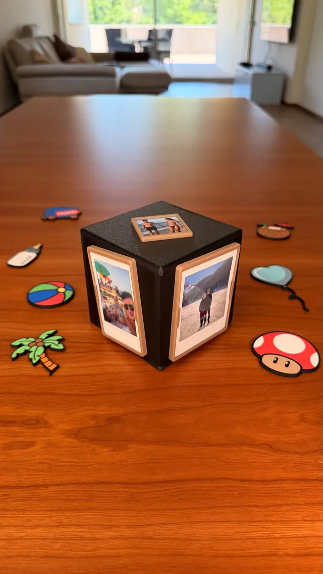 Two cubes with frames and magnets on their faces