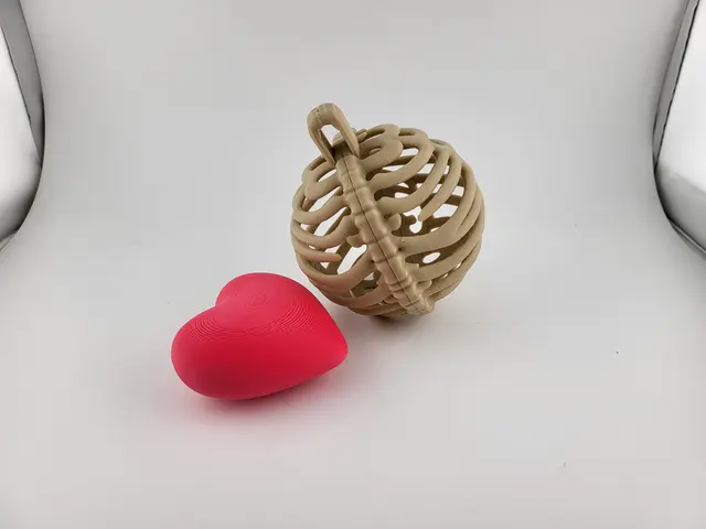 Rib cage Christmas bauble with a pink heart, view 2
