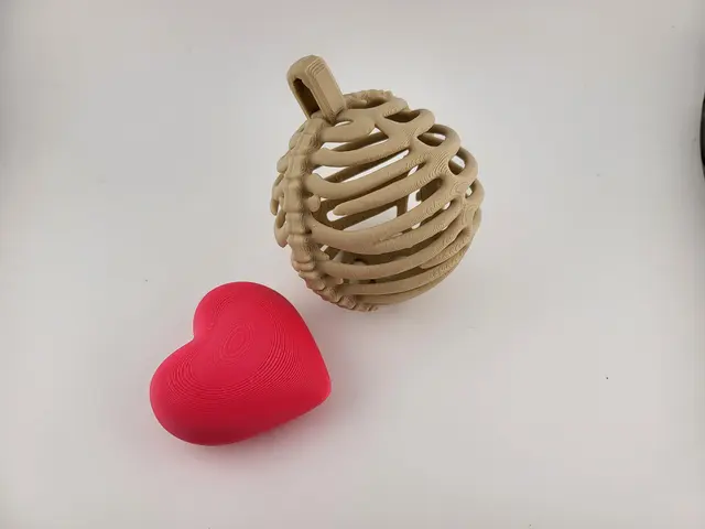 Rib cage Christmas bauble with a pink heart, view 3