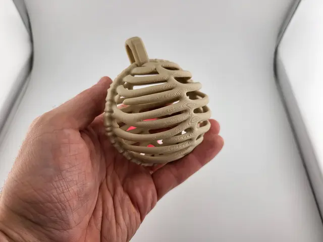 Rib cage Christmas bauble with a pink heart, view 6