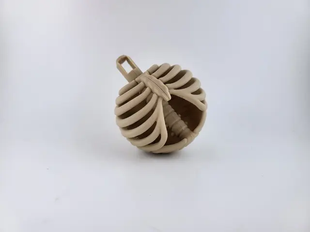 Bone-coloured rib cage Christmas bauble, view 6