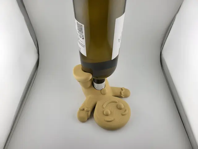 Gingerbread man wine bottle holder with a bottle of wine, view 3