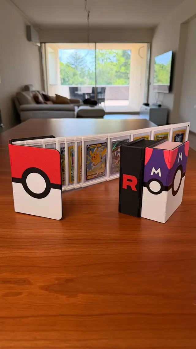 Binder open like an accordion with cards in a row, the cover showing a red and white ball