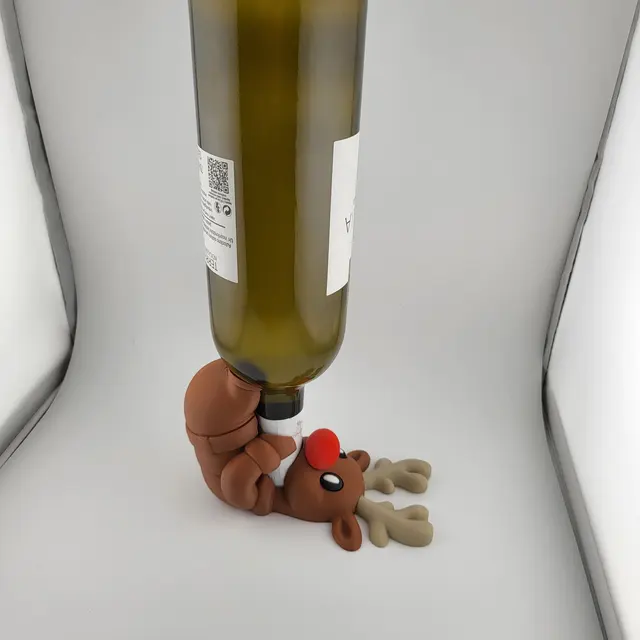 Red-nosed reindeer holding a bottle of wine