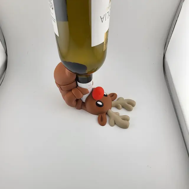 Red-nosed reindeer holding a bottle of wine, view 3