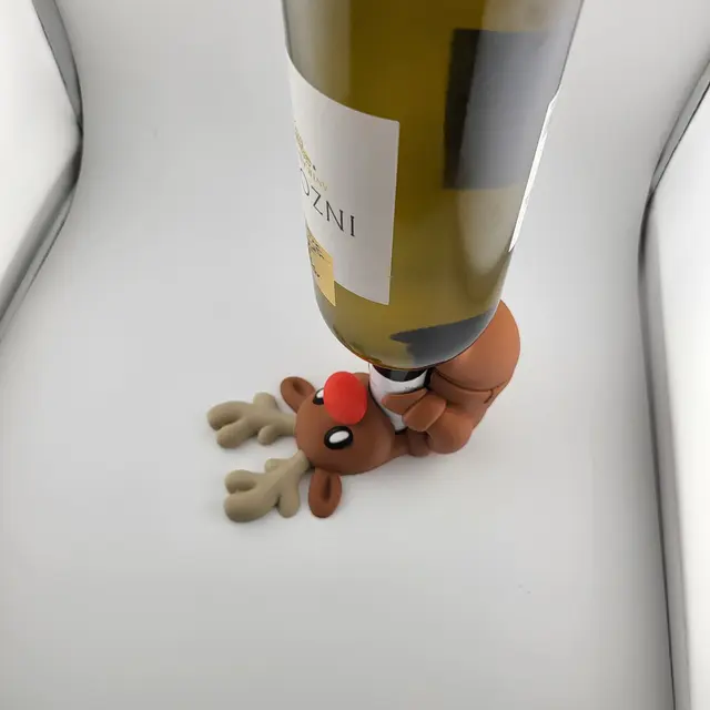 Red-nosed reindeer holding a bottle of wine, view 4