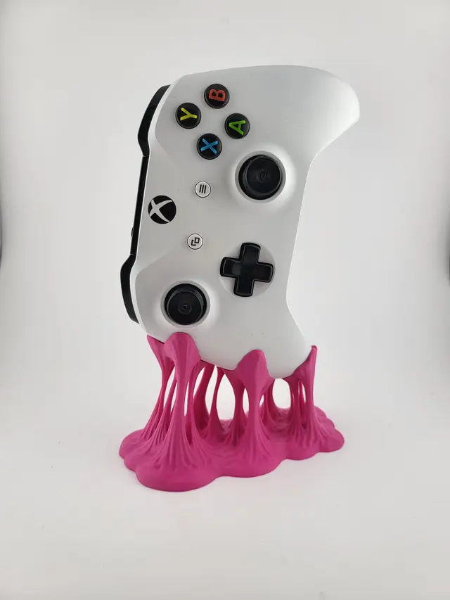 Supporto Bubble Gum rosa con un controller bianco