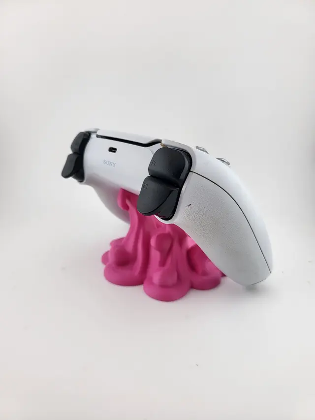 Pink dripping Slime stand with a white controller, another view