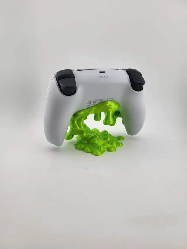 Lime green blob Slime stand with a white controller
