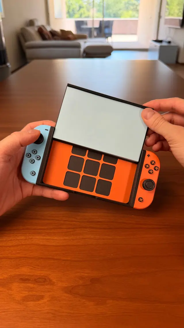 The screen lifted to reveal the tic-tac-toe grid