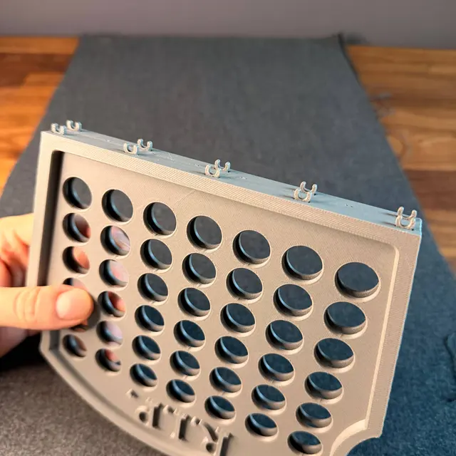 The game grid seen from above, with the holes for the pieces